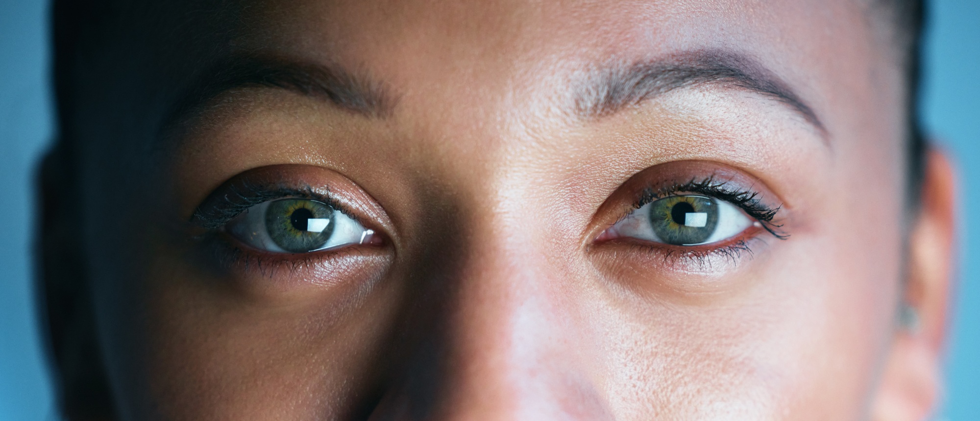 Woman, face and eyes looking for biometrics, optics or vision in the future for scanning identity.